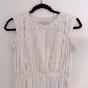 Light cream boho style mid-length dress with eyelet detailing. Lined.